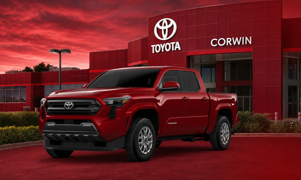 | 2026 Toyota Trucks: Tacoma vs Tundra Specs, Prices, Reliability; What’s New Red Toyota truck parked outside dealership with glowing red sky