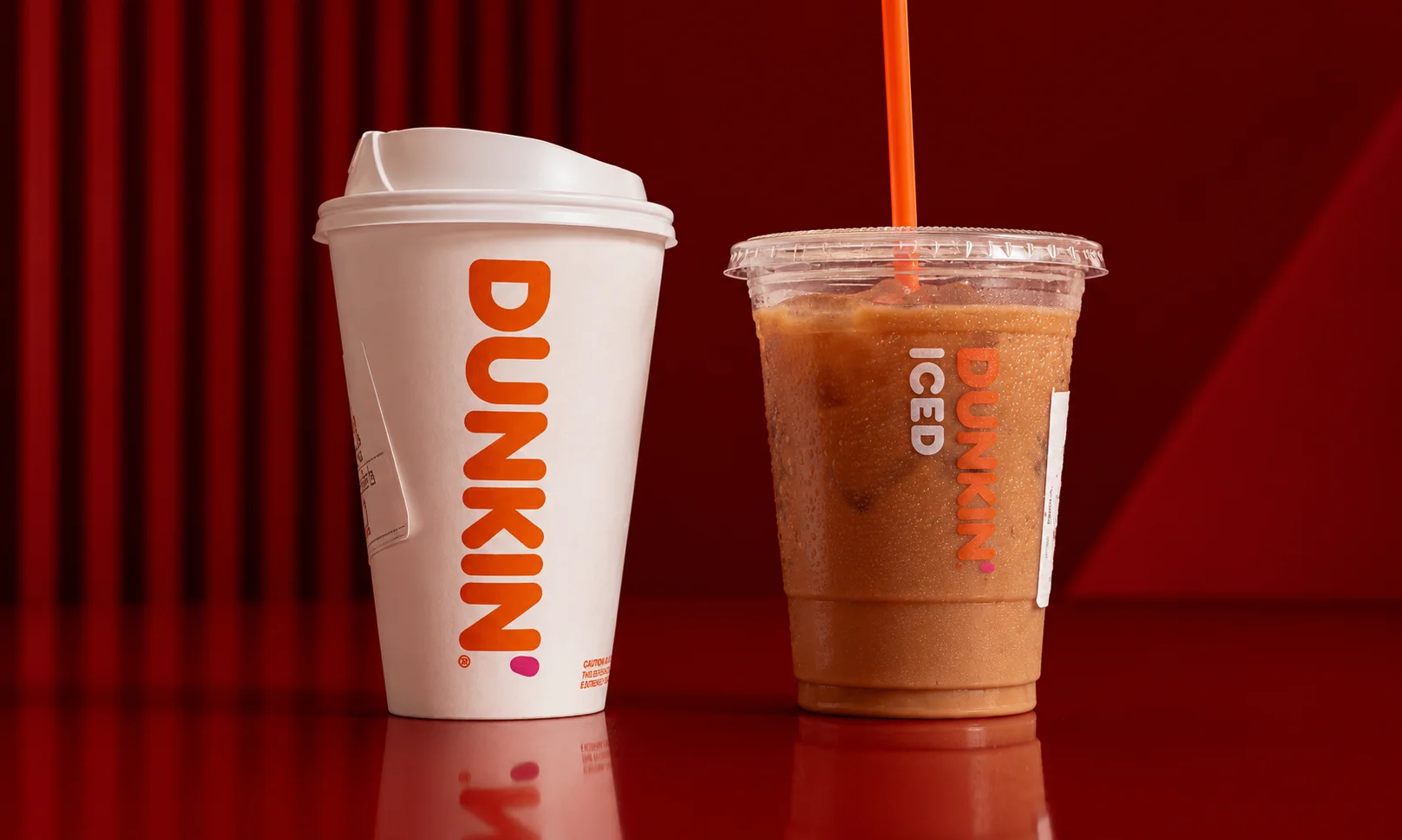 Dunkin' branded coffee cups and packaging displayed together.