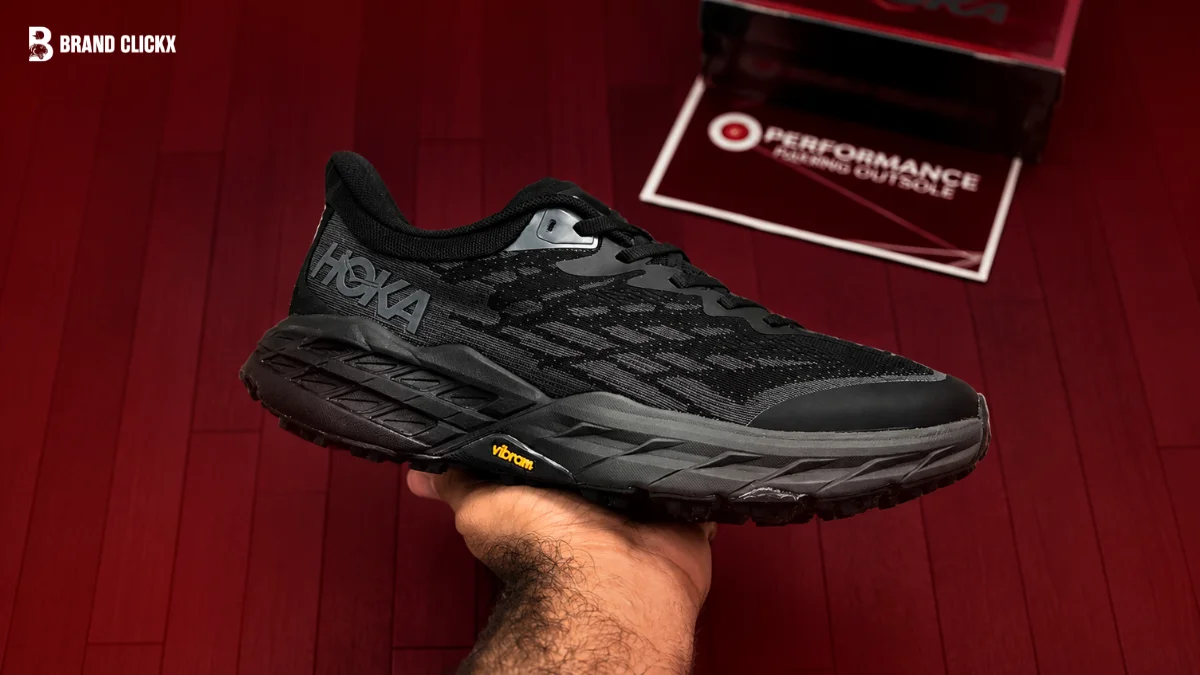 HOKA SHOES A brand showcase graphic featuring a black Hoka running shoe against a dark red background.