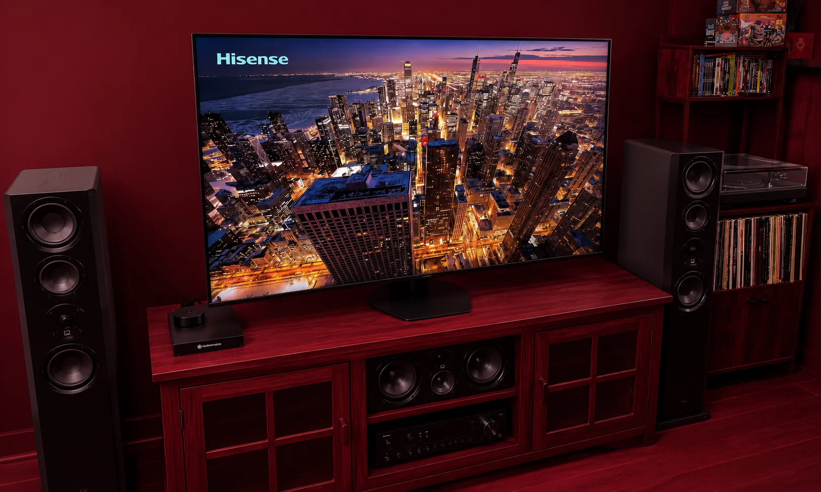 Hisense TV models shown against a dark red backdrop.