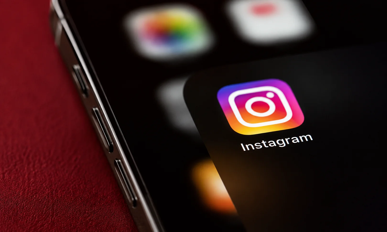 A close-up view of a mobile phone screen displaying the Instagram application icon.