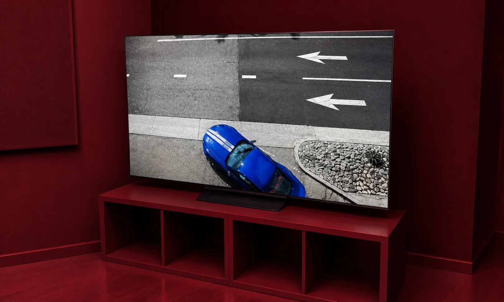 An LG C6 OLED television showcased on a clean media console.