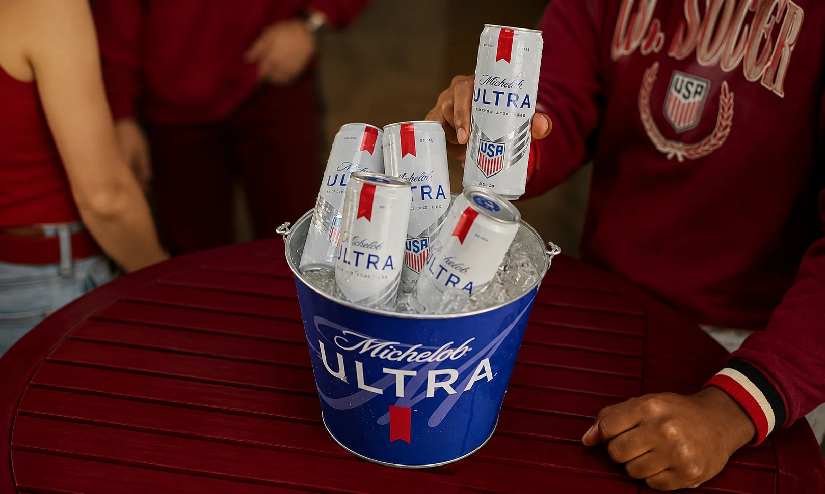 Michelob Ultra beer bucket and bottles displayed on a red table setting