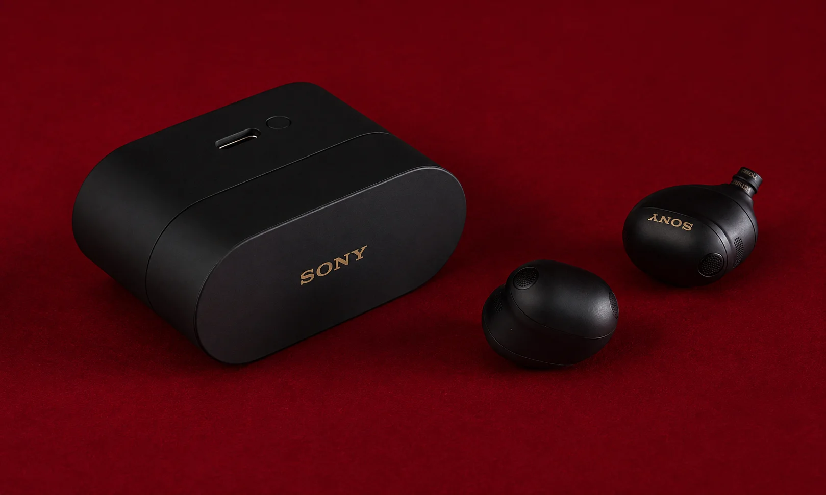 Sony WF-1000XM6 black wireless earbuds and charging case with gold branding