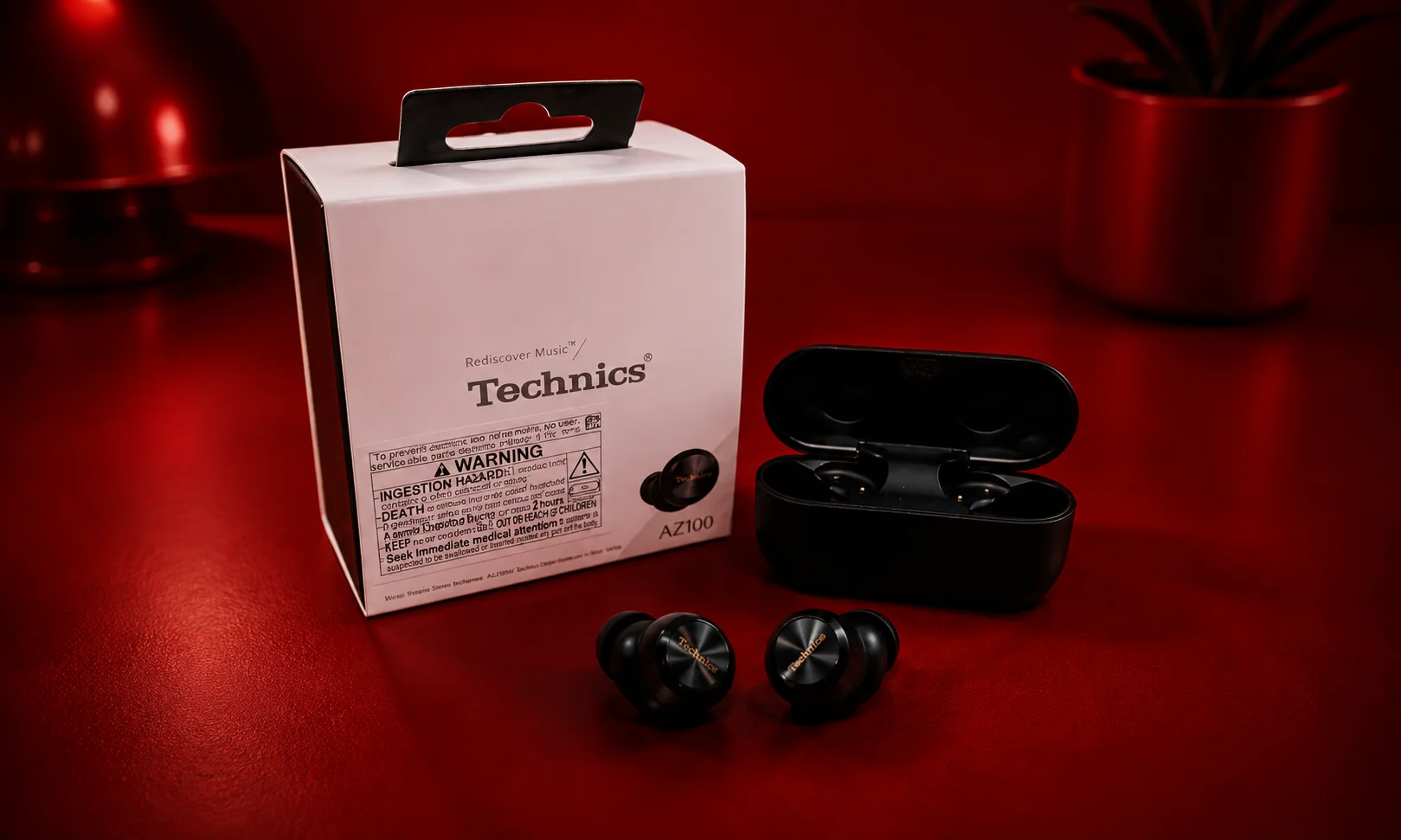Technics earbuds showcased alongside their packaging box.