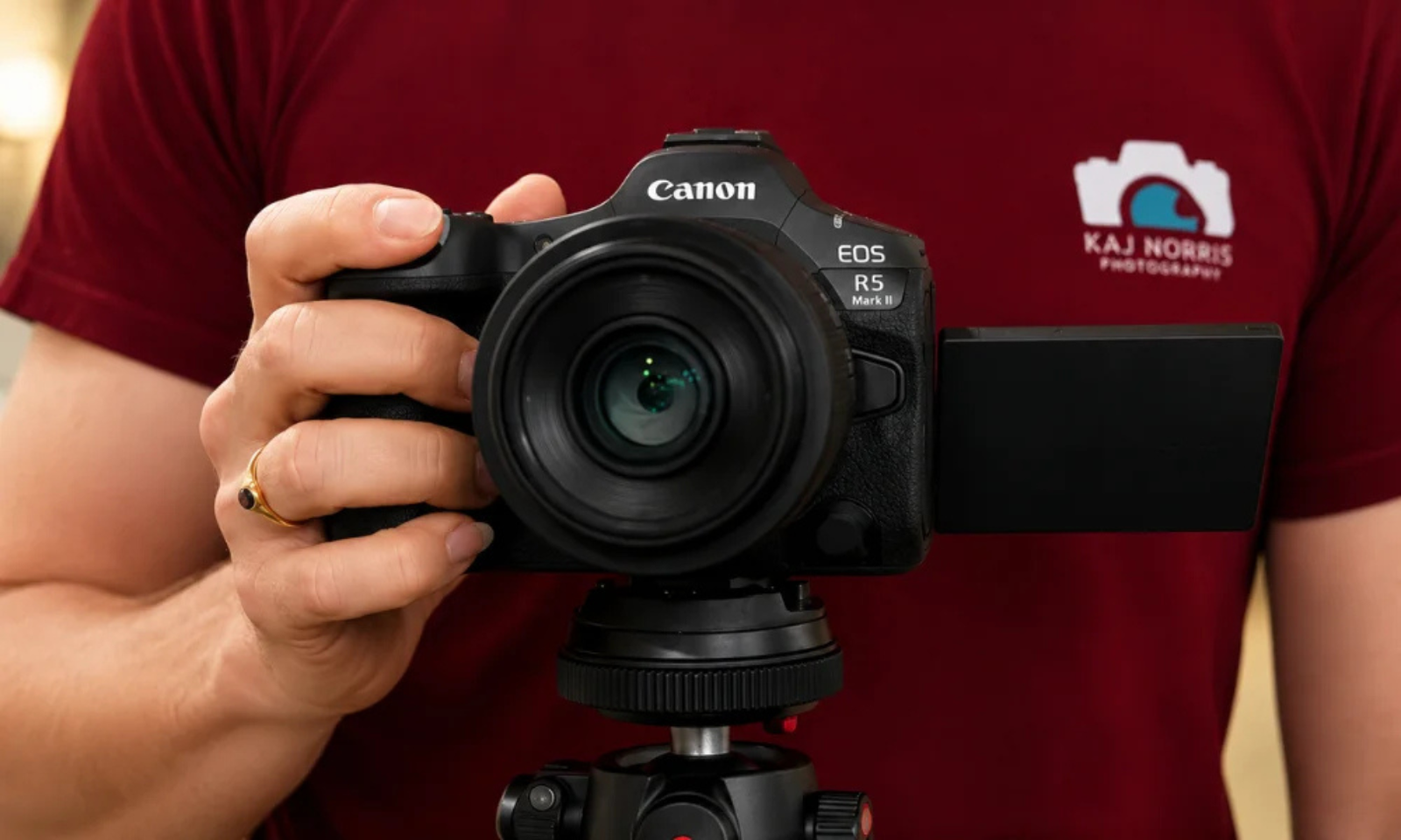 professional mirrorless camera mounted on a tripod with an articulated screen