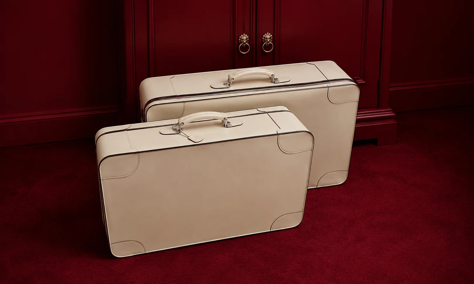 | 15 Best Luxury Luggage Brands for Travelers in 2026 Cream-colored Valextra luxury suitcases set in a warm studio environment.