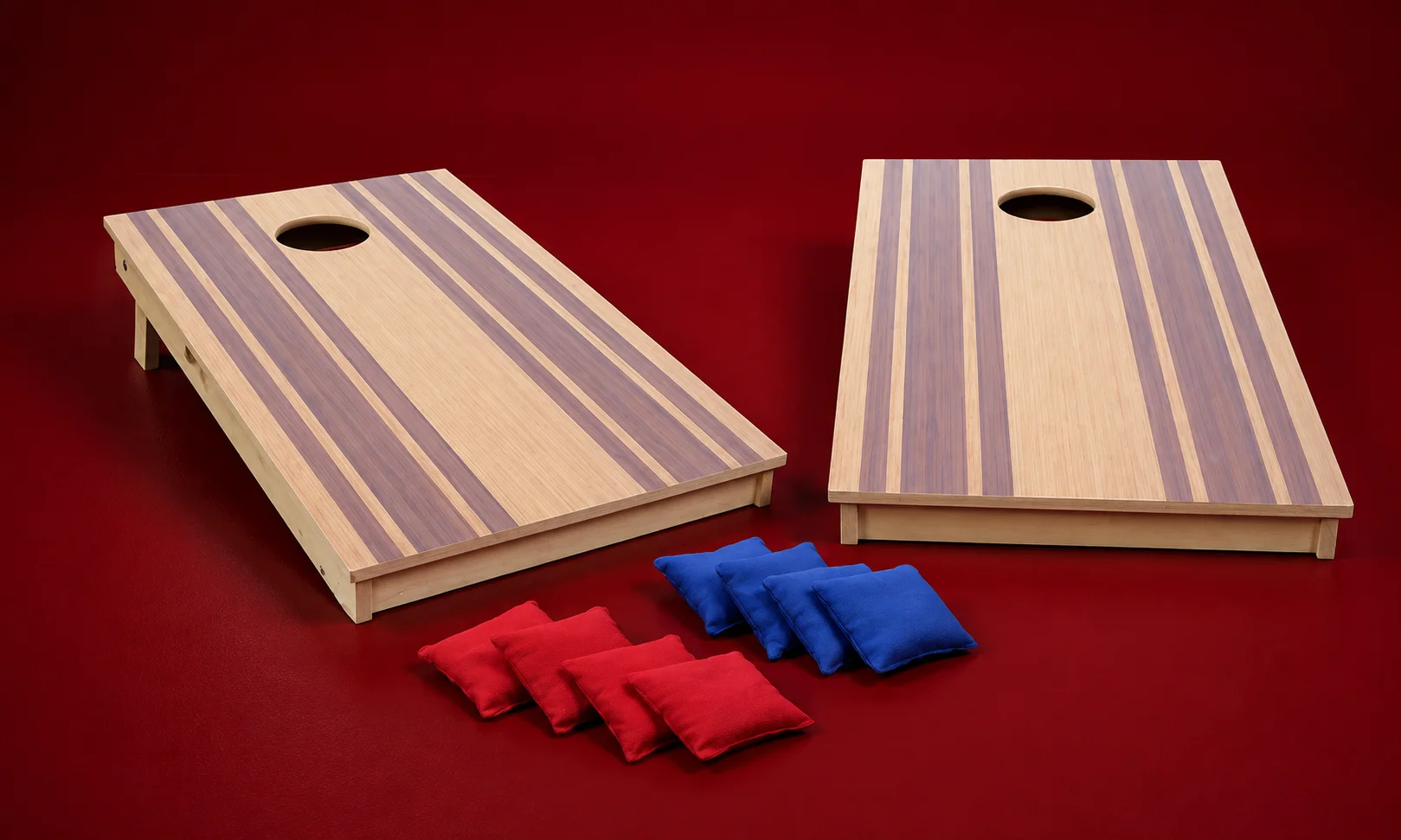 Full cornhole game set showing two wooden boards and eight colorful cornhole throwing bags.