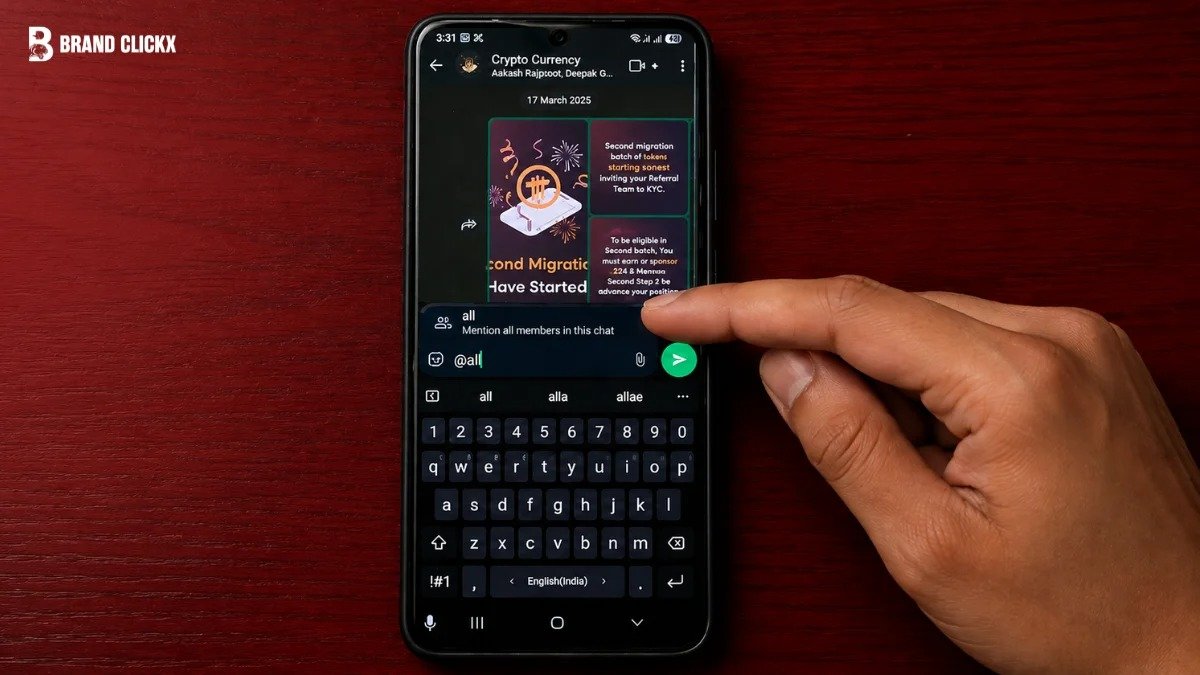 Smartphone displaying a cryptocurrency chat interface with a finger typing an @all message against a rich dark red background