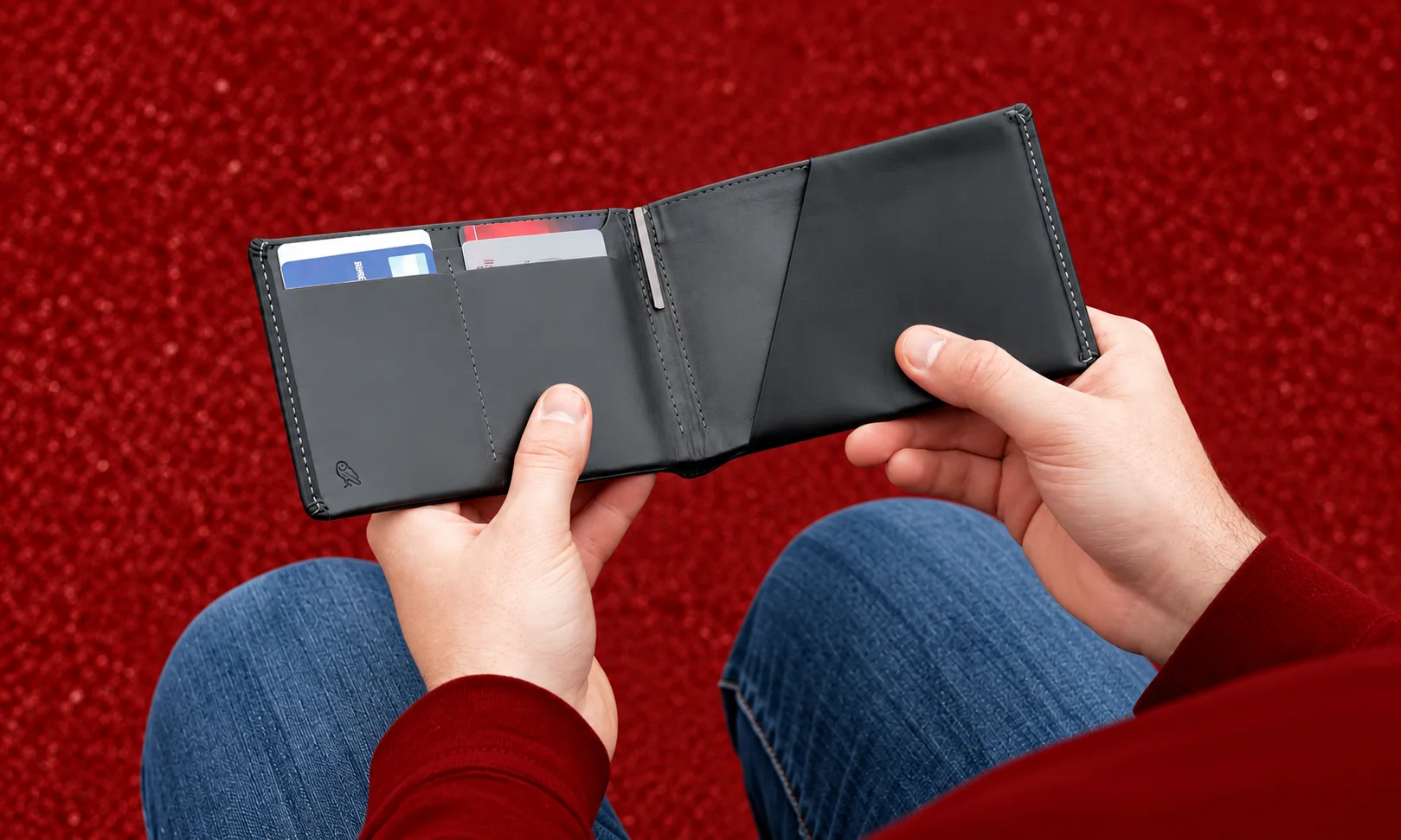 Unfolding the Bellroy Travel Wallet to showcase card slots, currency dividers, and passport storage.