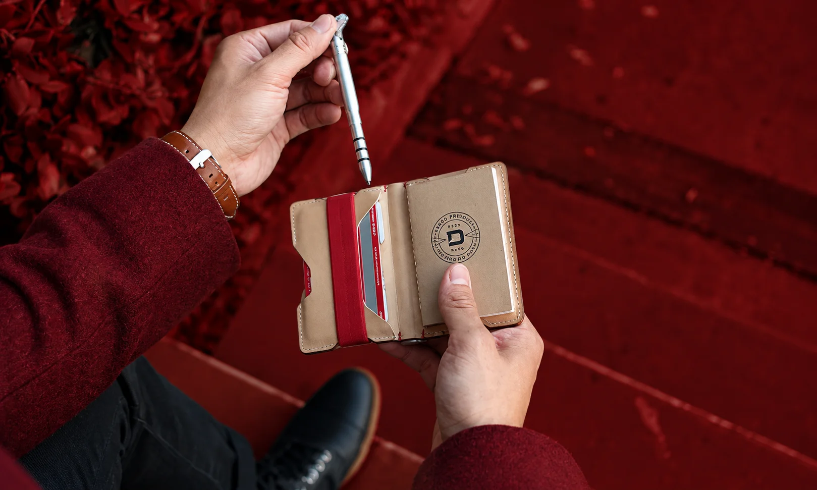 Dango P01 Pioneer Travel Wallet featuring a multi-tool clasp, card slots, and an integrated pen.