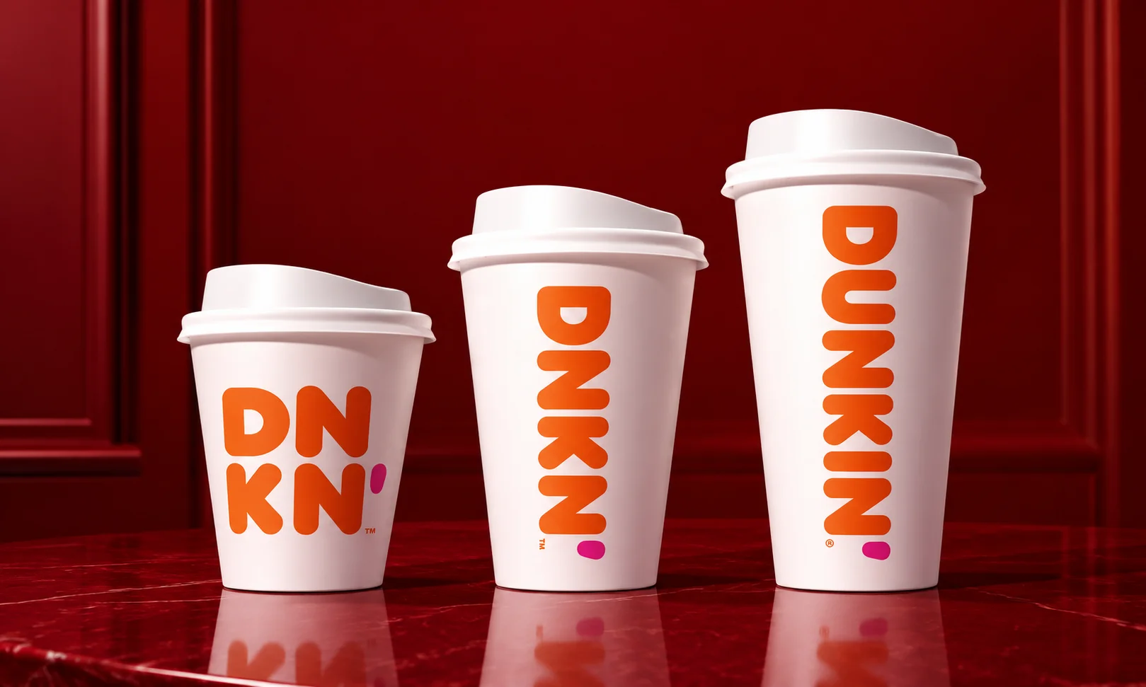 | Rebrands That Worked: Successful Rebrand Examples and the Reasoning Behind Them Dunkin coffee cups showing simple name change case study in Successful Rebrand Examples