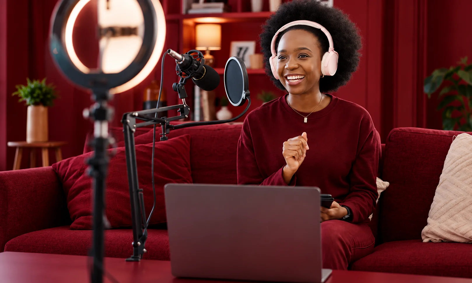 Female creator wearing headphones recording audio content following Creative Brief format