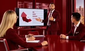 | CMO Tenure in 2026: The Numbers Behind the Churn CMO presenting marketing strategy and performance data to an executive team