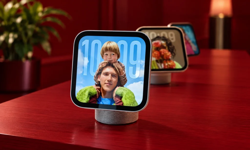 Apple HomeView smart home display with a family photo on screen, demonstrating its touchscreen design and personalized interface.