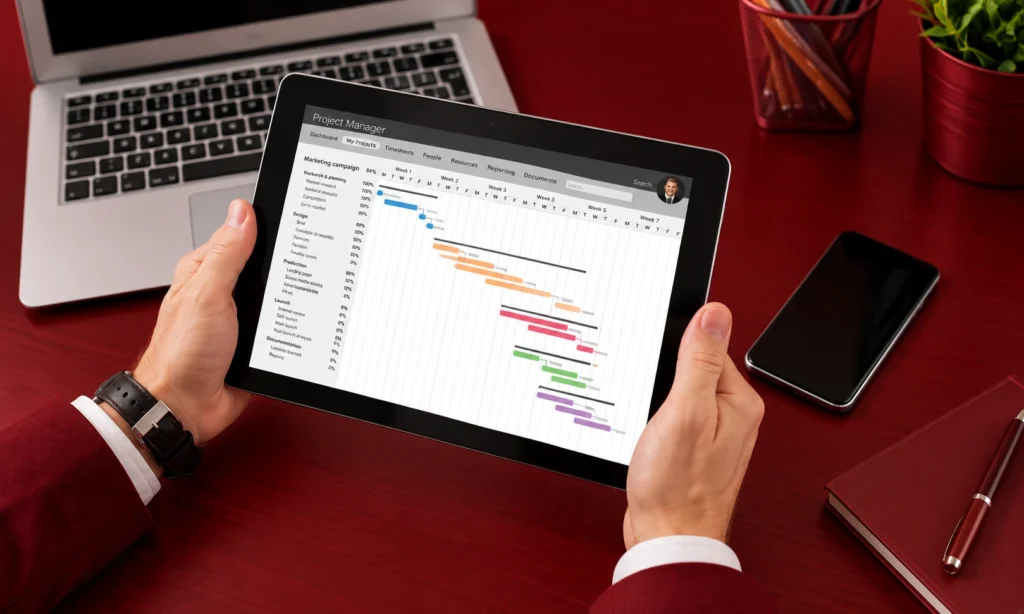 Project management tools showing a project timeline on a tablet, with campaign tasks and schedules organized in one view.