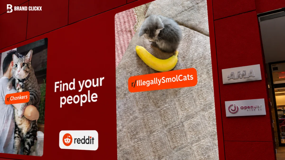 Reddit advertising campaign displaying community posts and the Reddit brand logo on a red wall.